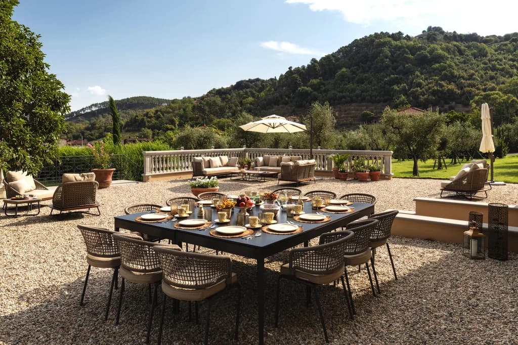 Villa Elisa outdoor terrace dining for twelve with Tuscan hill views, Lucca, Italy