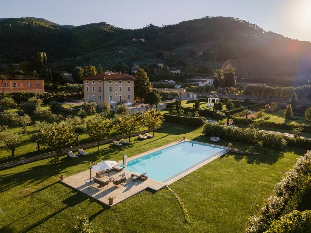 Villa Elisa outdoor lap pool with olive trees and formal garden, Lucca, Italy