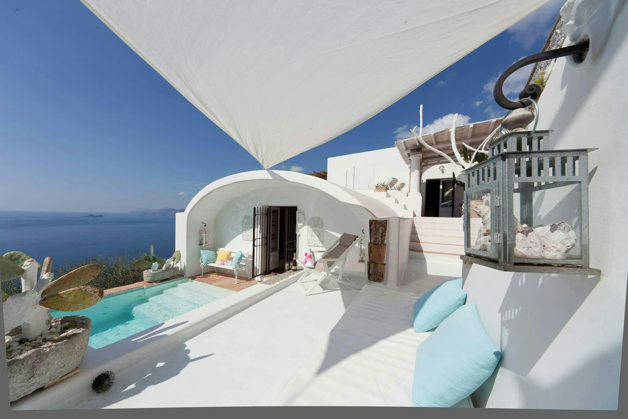 Summer in Praiano villa exterior with white archways and tiered pools, Praiano, Amalfi Coast, Italy