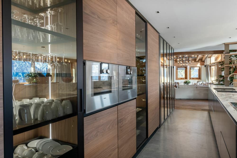 Courchevel 10 chef kitchen with Gaggenau ovens and walnut cabinetry, Courchevel 1850, France
