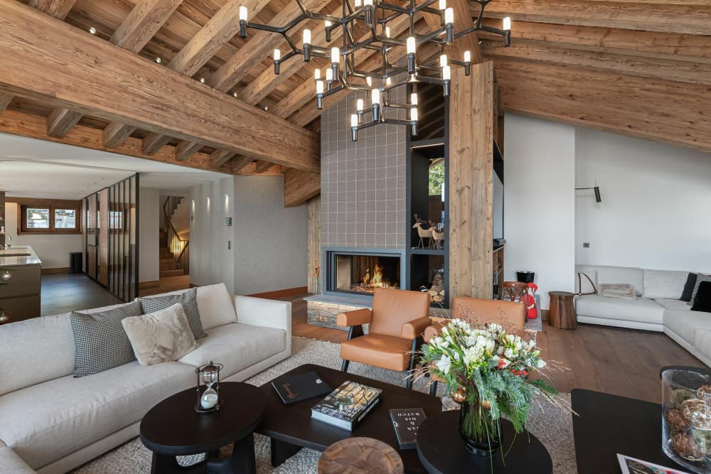 Courchevel 10 fireplace lounge with double-sided fireplace and branched chandelier, Courchevel 1850, France