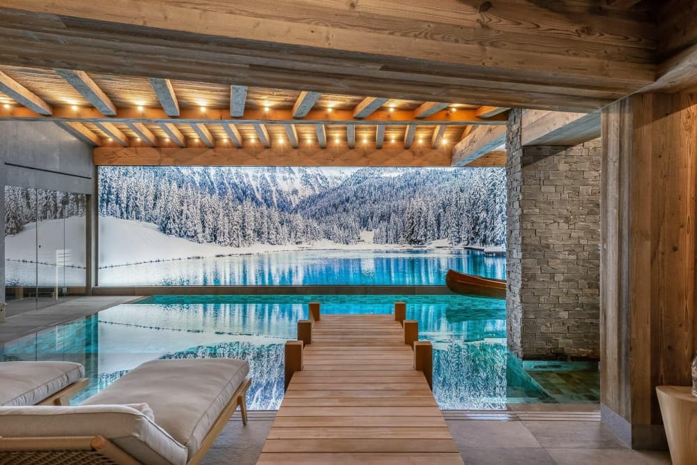 Courchevel 10 indoor spa pool with timber pier walkway and sun loungers, Courchevel 1850, France