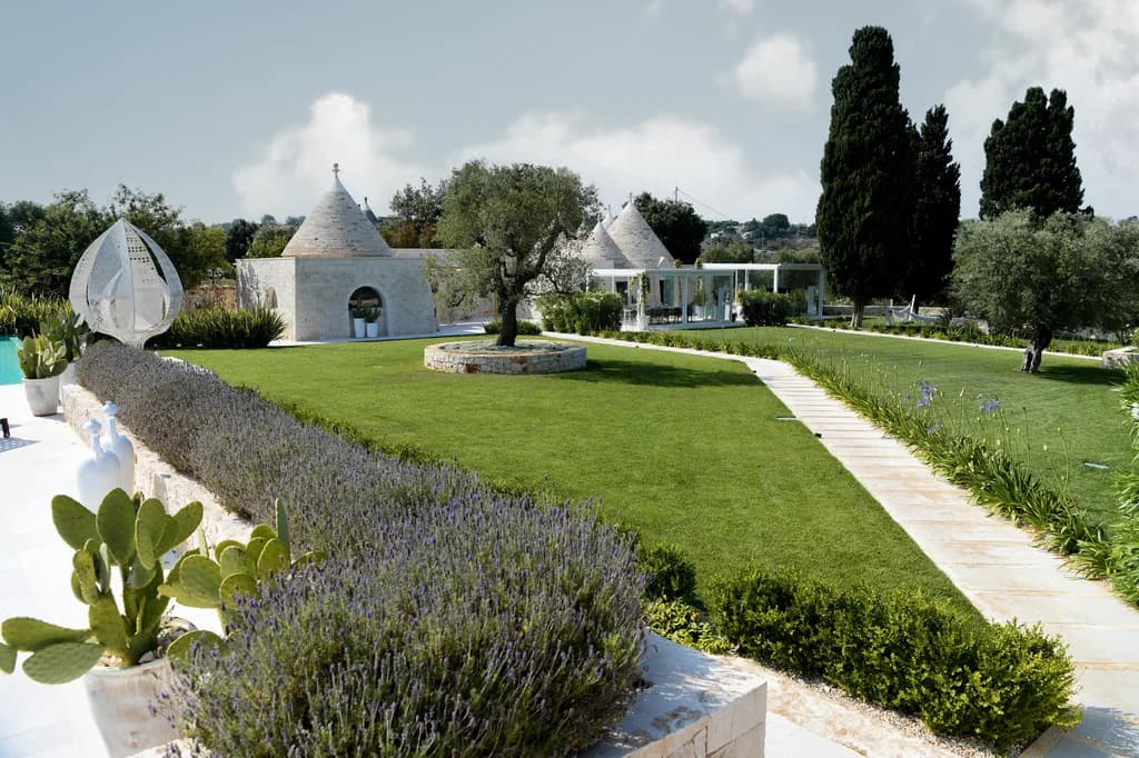 Dimora Pomona garden landscape with lavender, cactus and trulli, Cisternino, Puglia, Italy