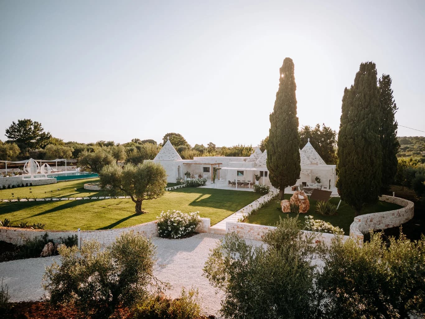 Dimora Pomona trullo estate exterior with pool and olive groves, Cisternino, Puglia, Italy