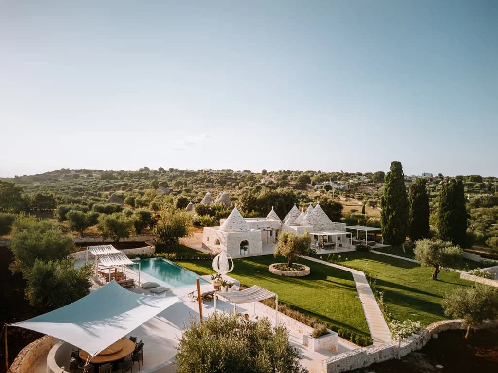 Dimora Pomona aerial landscape view of trulli and swimming pool, Cisternino, Puglia, Italy