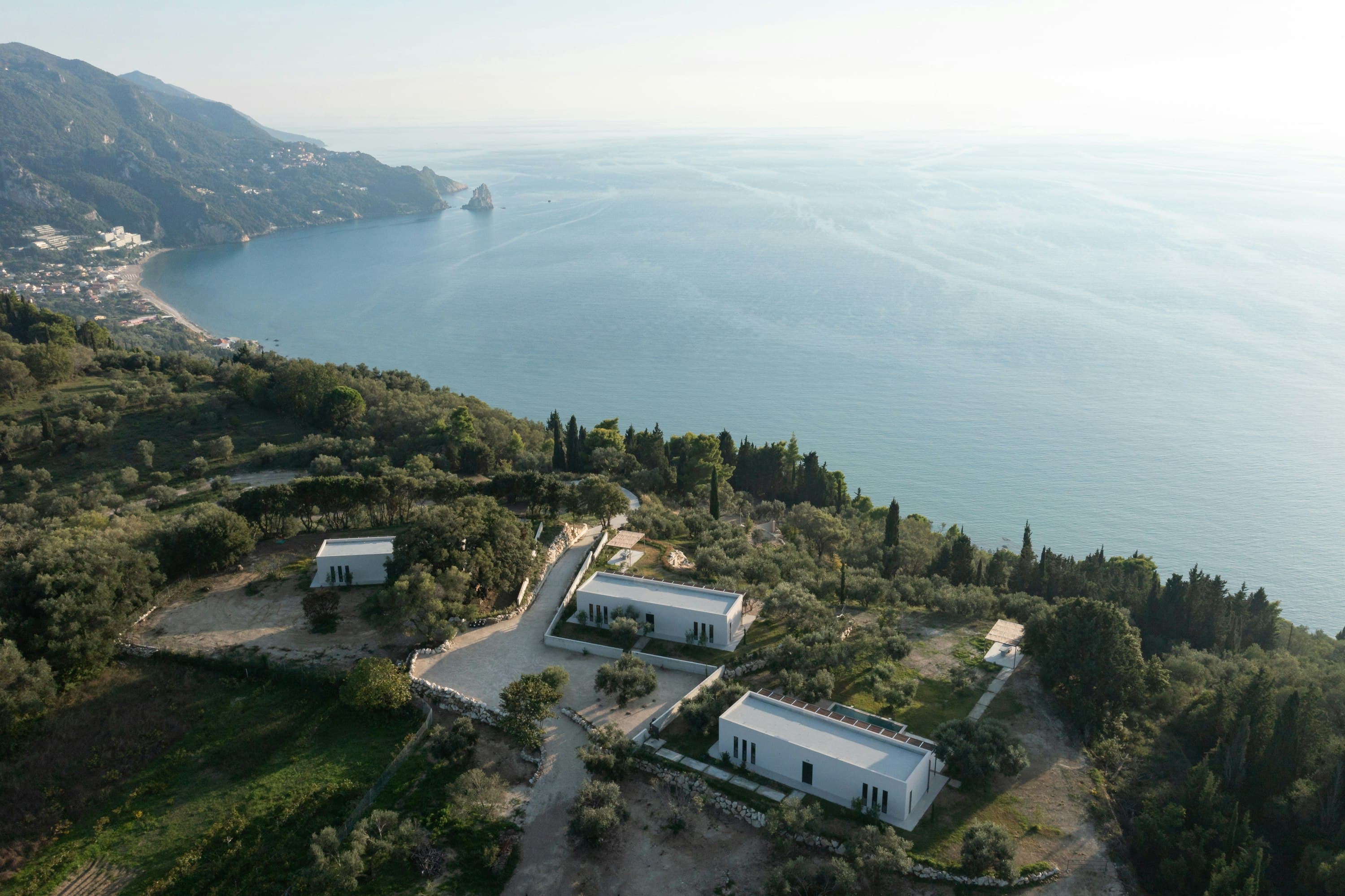 Corfu Dreams aerial coastal view of hillside villas and Ionian Sea, Corfu, Greece