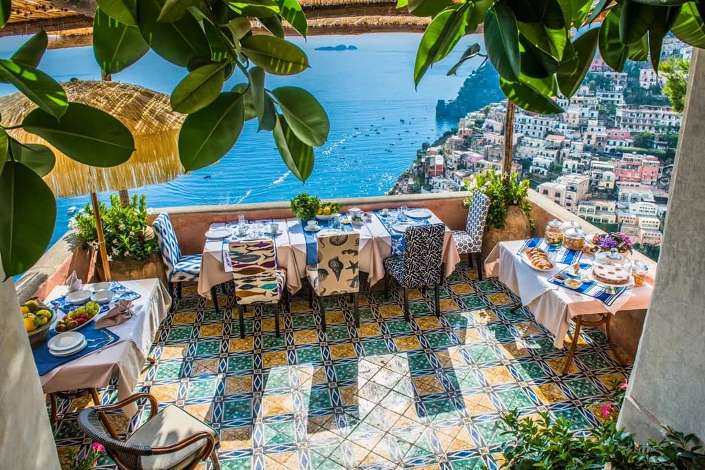 Villa San Giacomo al fresco dining terrace with Vietri tiles and Positano views, Italy