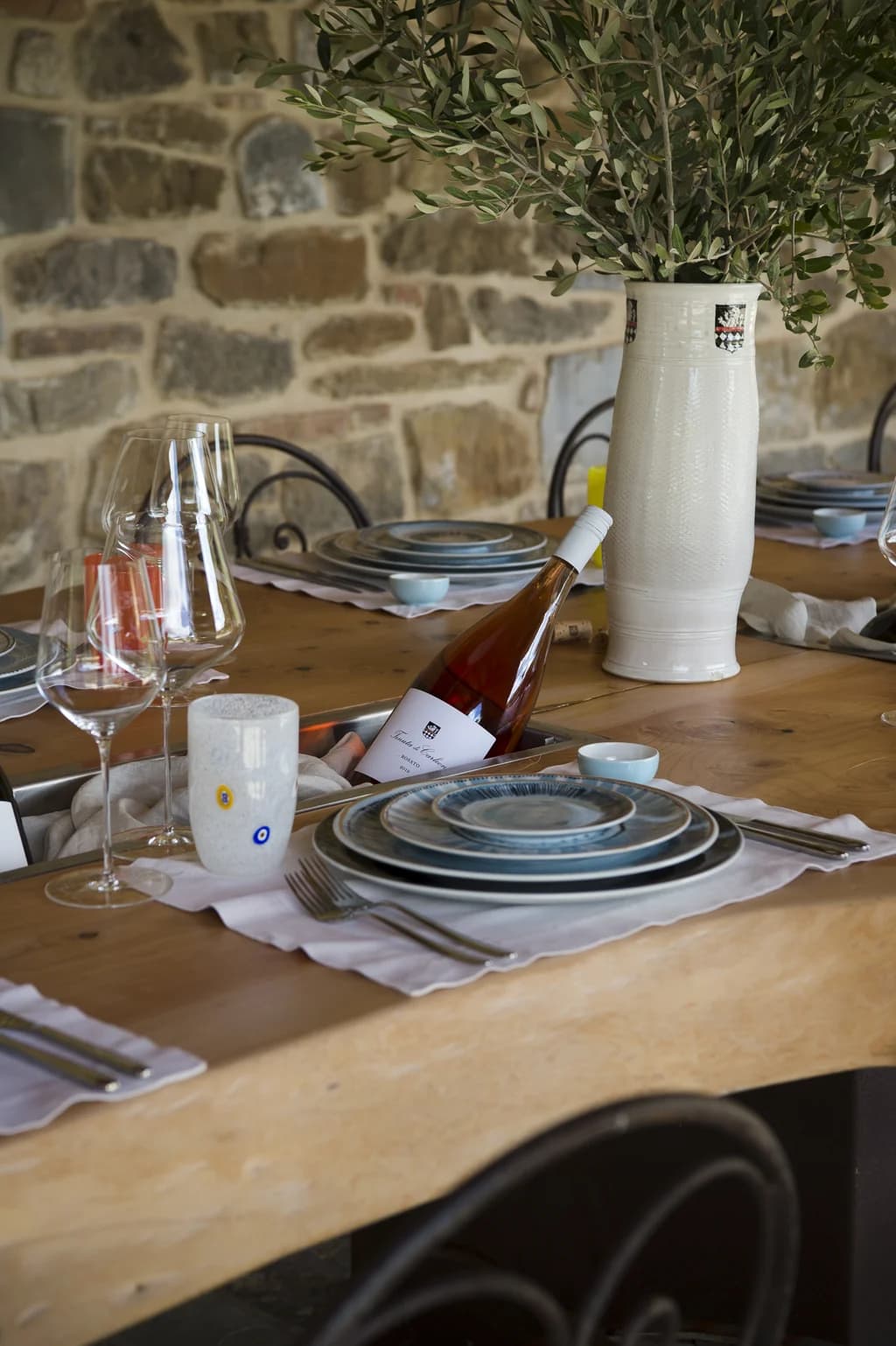Villa Fieravista al fresco dining table with local rosé and ceramics, Radda in Chianti, Italy
