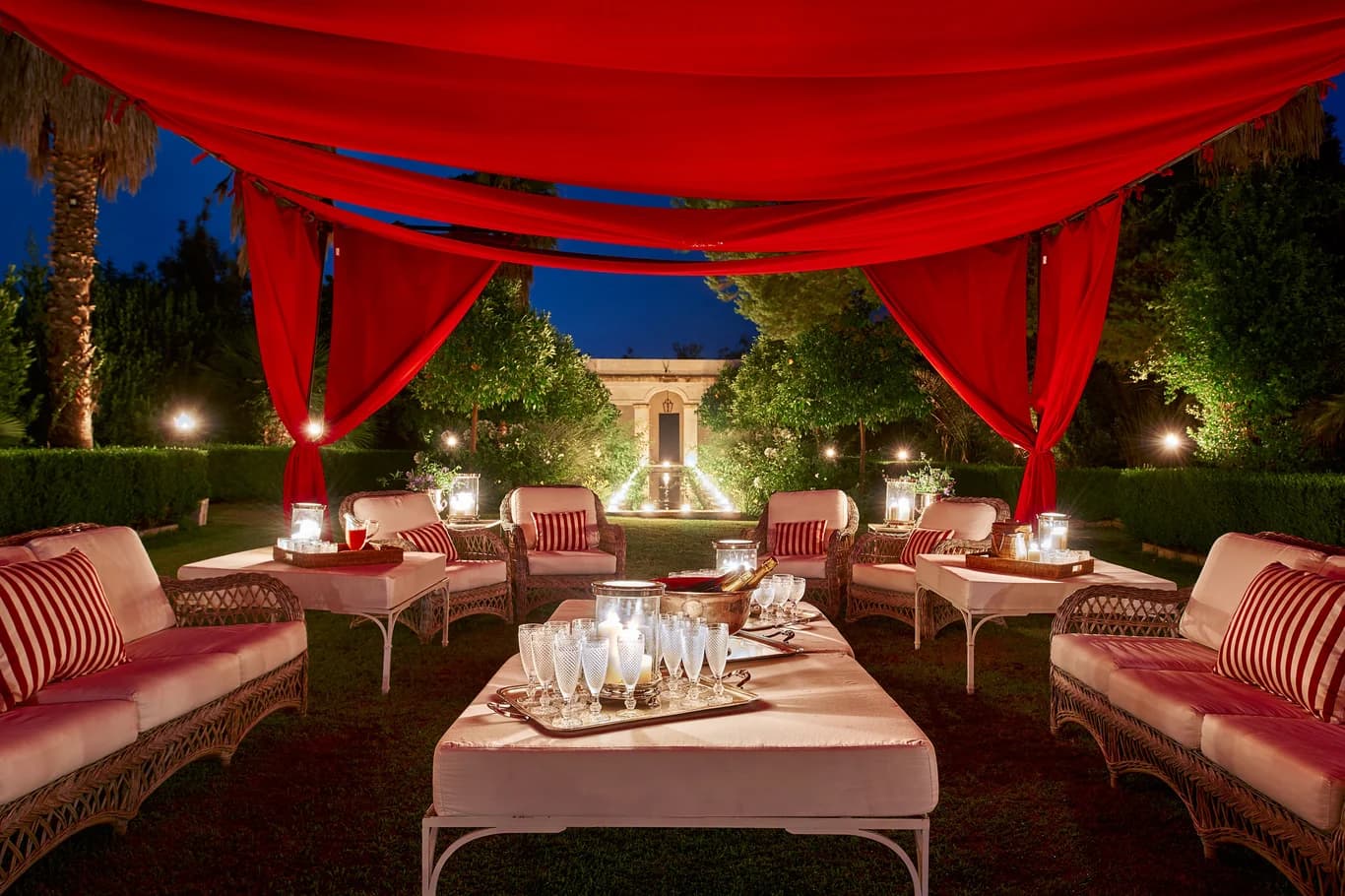 La Dimora del Santo outdoor lounge cabana with canopy at dusk, Brucoli, Sicily, Italy