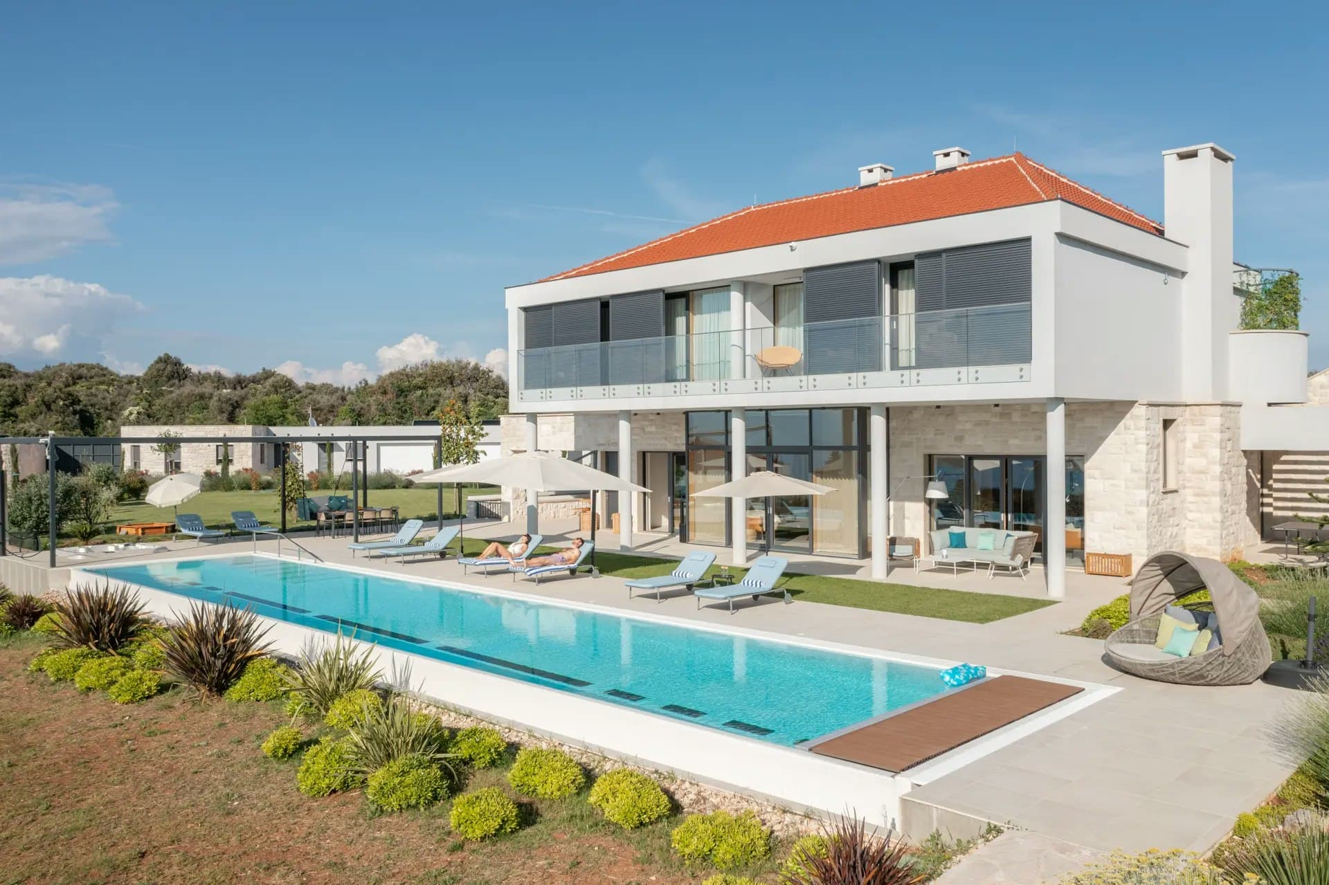 Flowers in the Breeze villa exterior with infinity pool and terracotta roof, Supetar, Croatia