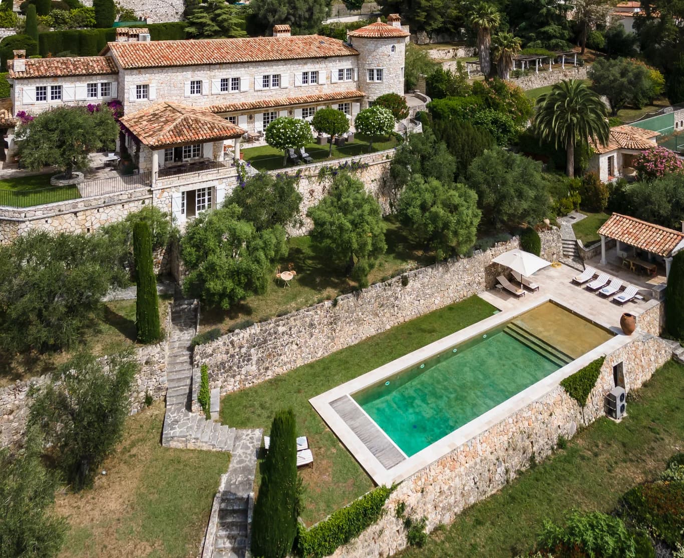 Bastide Splendide aerial exterior view, historic stone manor with terraced pool, Vence, France