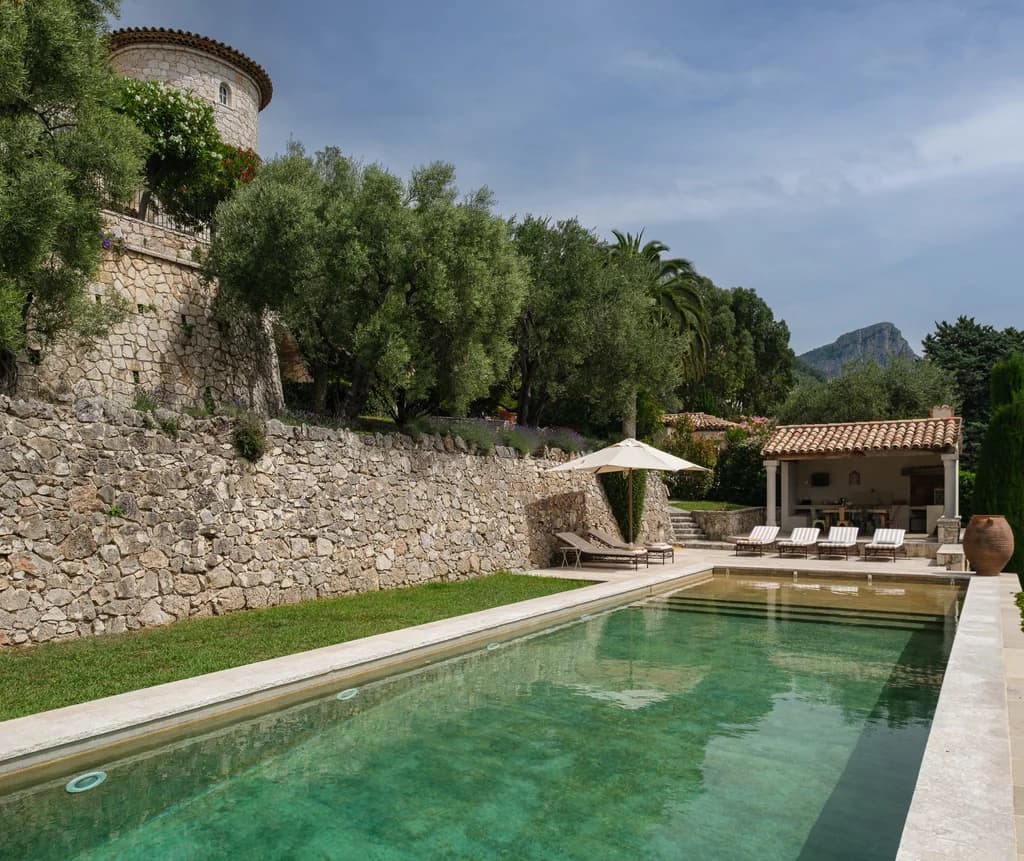 Bastide Splendide lap pool with medieval tower and colonnaded pool house, Vence, France