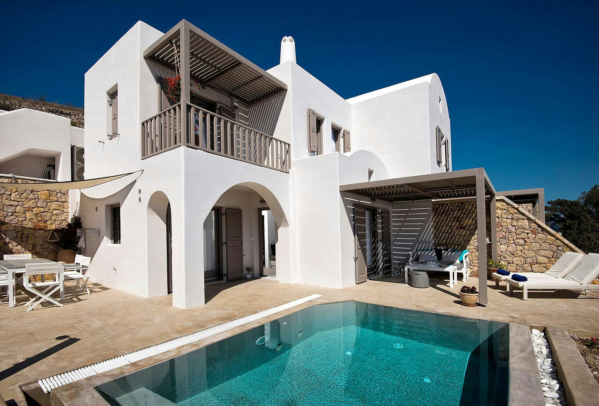 Grecian Gazing villa exterior with infinity pool and Cycladic architecture, Santorini, Greece