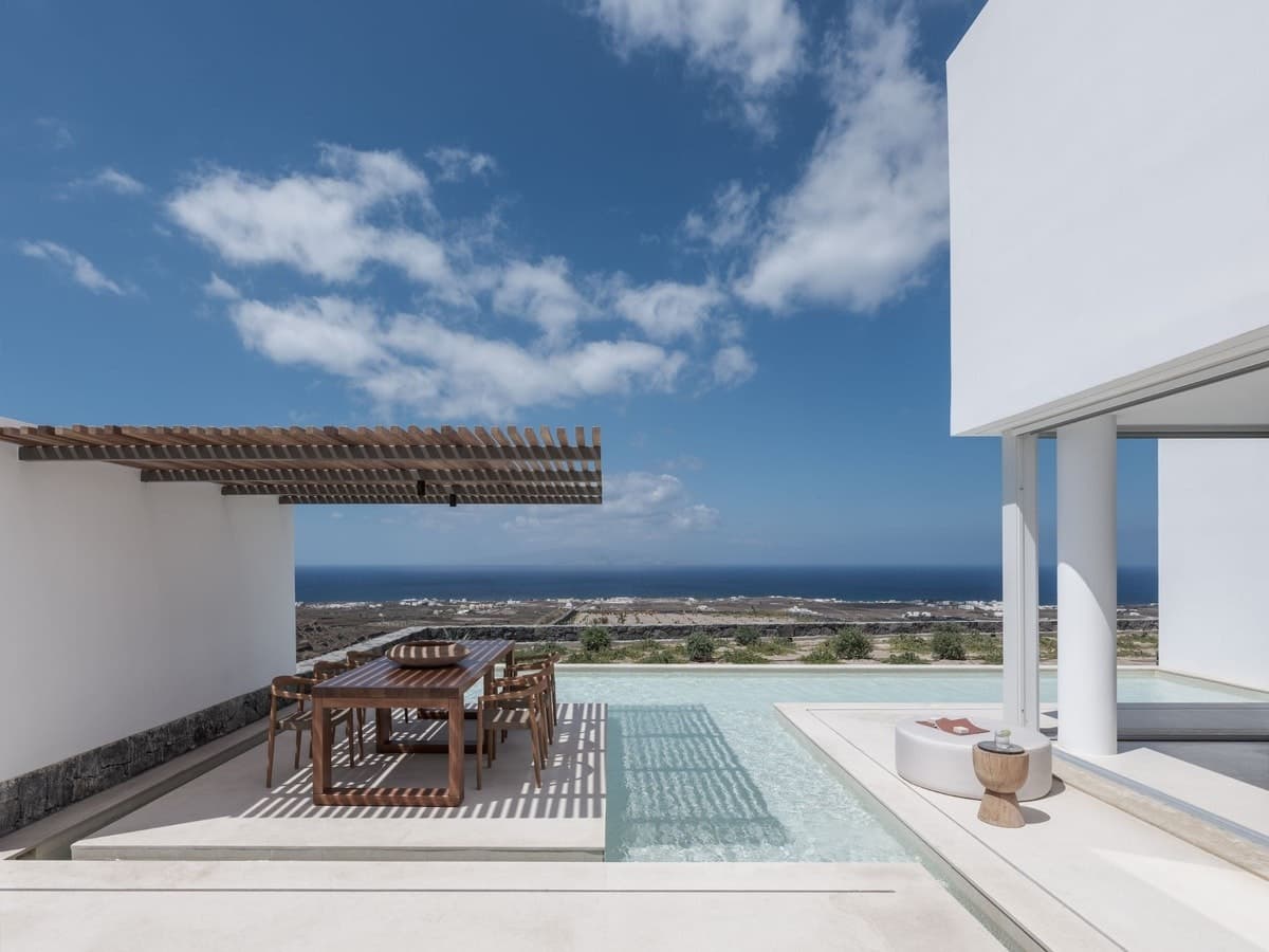 Splendid Shores pool terrace with dining area overlooking the Aegean, Oia, Cyclades Islands, Greece