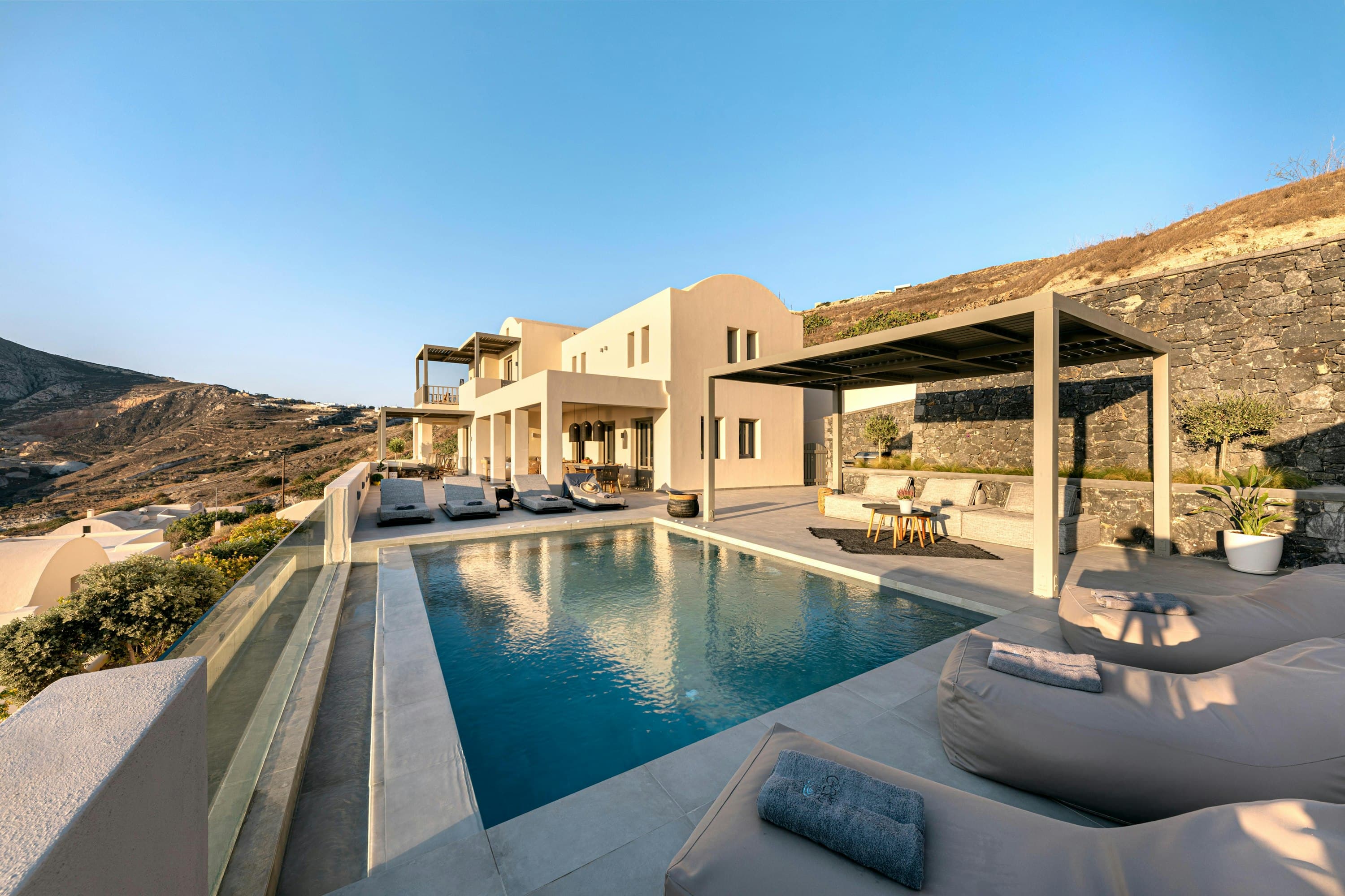 Smile Upon You villa exterior with infinity pool and terraces, Pyrgos, Cyclades Islands, Greece