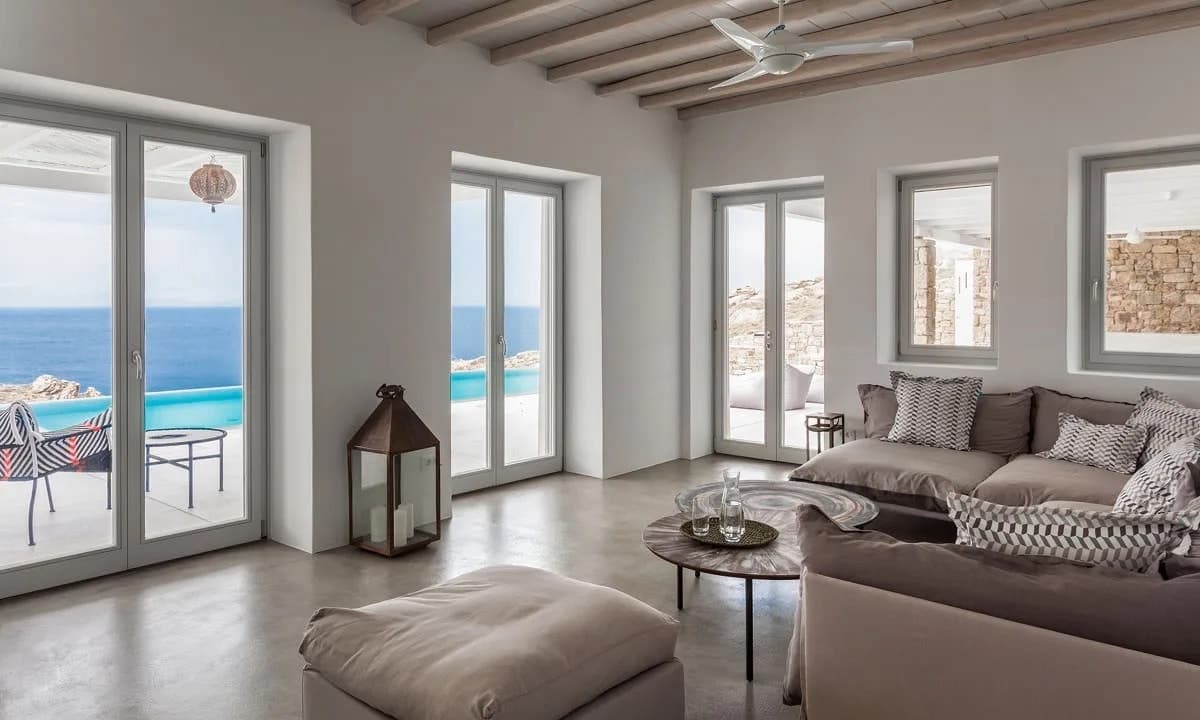 Ancient Azure Vistas main living room with sea-facing doors, Mykonos, Cyclades Islands, Greece