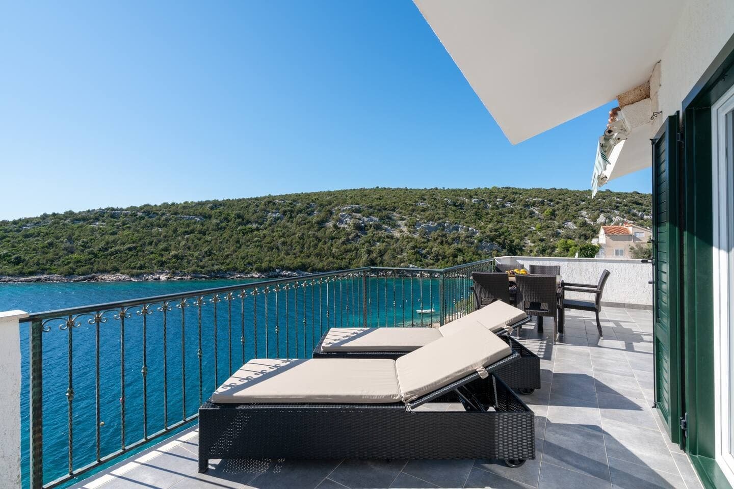 Blue All Around waterfront terrace with sun loungers overlooking Adriatic, Marina, Dalmatian Coast, Croatia