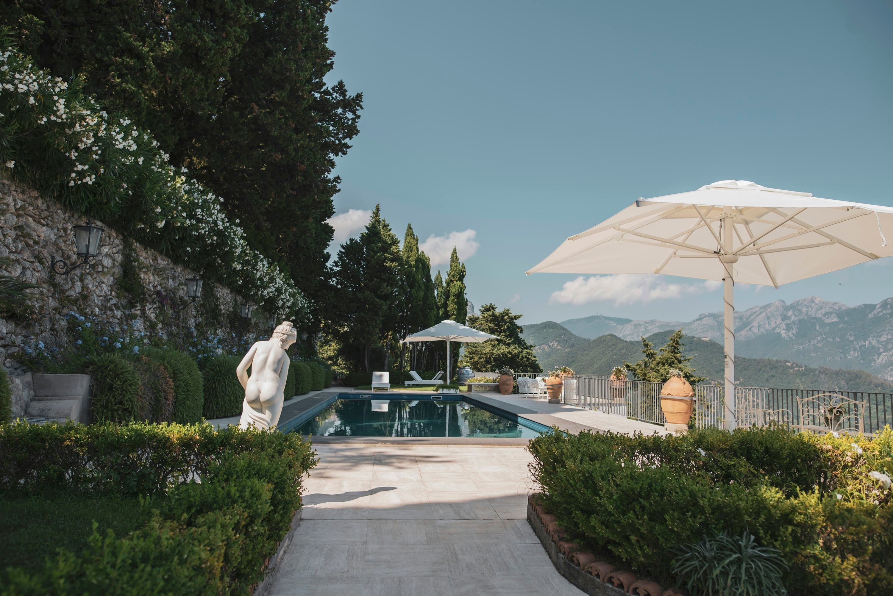 The Enchanting Terrace swimming pool with classical sculpture and gardens, Salerno, Amalfi Coast, Italy