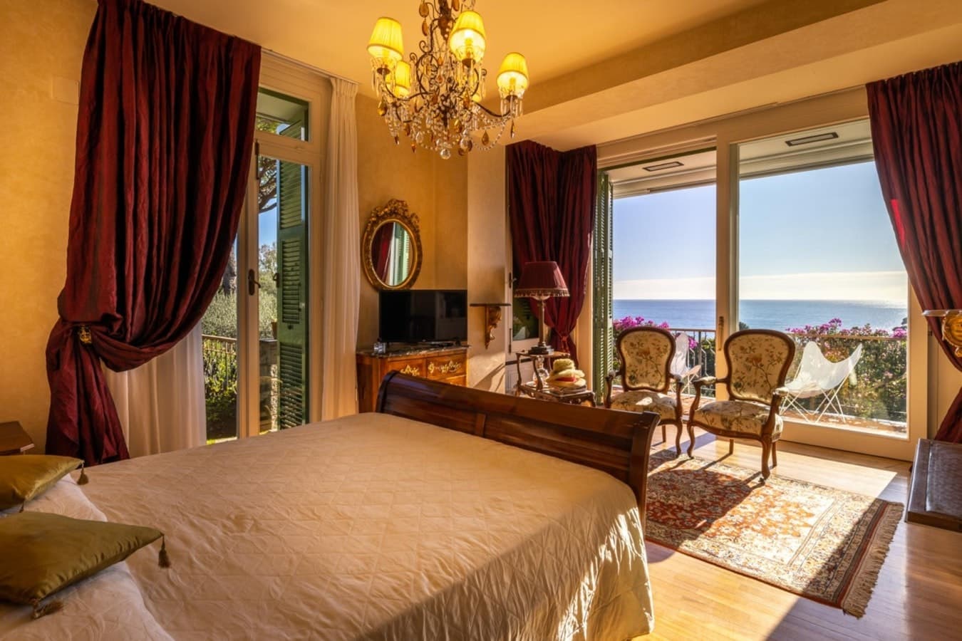 On the Emerald Coast master bedroom with chandelier and terrace, Rapallo, Italian Riviera, Italy