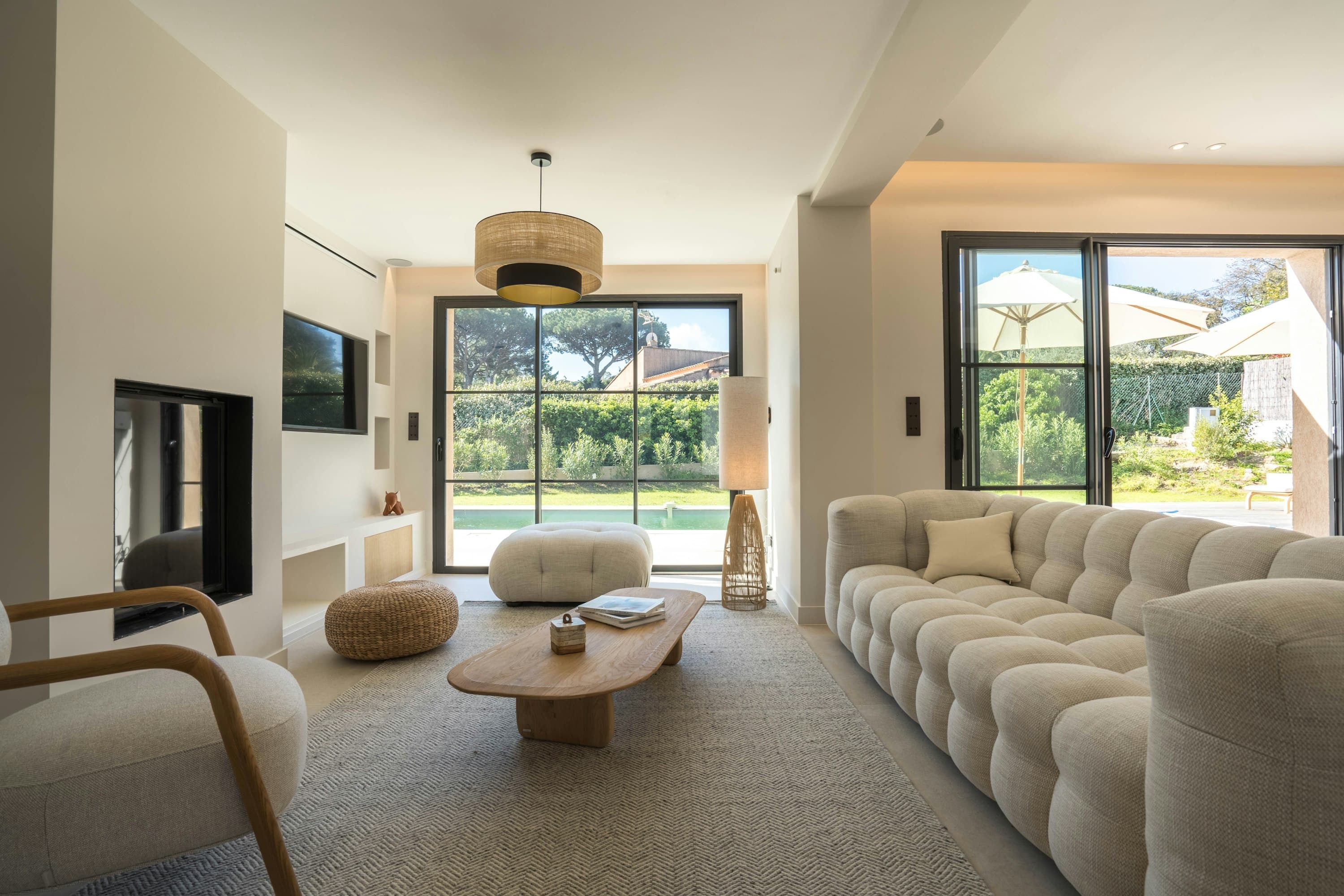 Riviera Echo living room with boucle sofa and pool views, Saint-Tropez, France