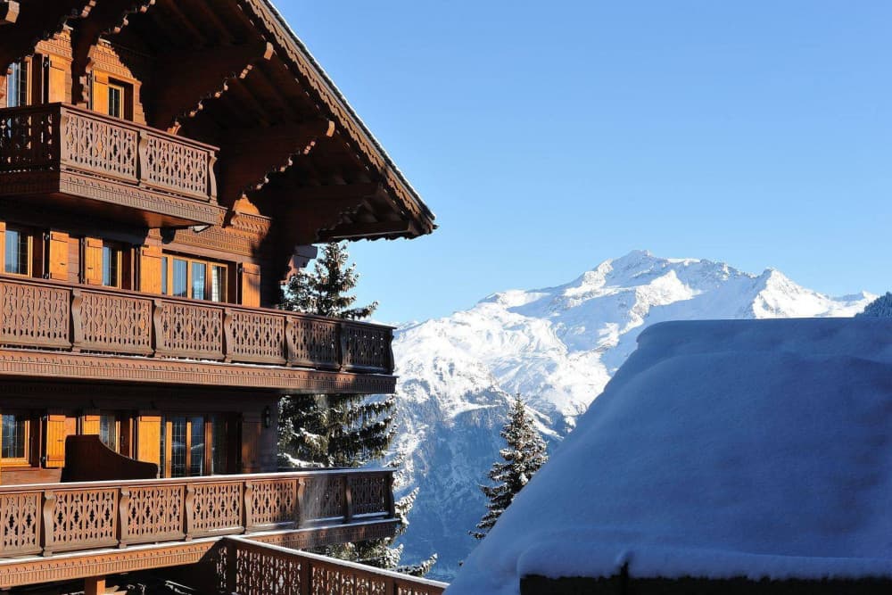 Courchevel 37 exterior facade with carved wooden balconies, Courchevel 1850, France