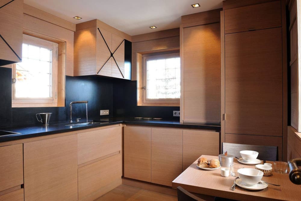 Courchevel 37 gourmet kitchen with oak cabinetry and granite surfaces, Courchevel 1850, France
