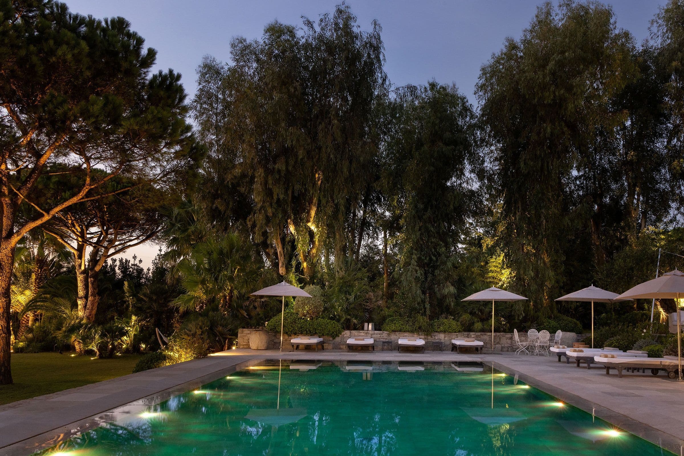 Villa Maï Taï evening pool with architectural lighting at twilight, Saint-Tropez Peninsula, France