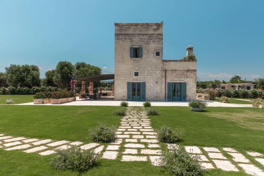La Piccola Torre historic stone tower exterior with limestone pathway, Savelletri, Puglia, Italy