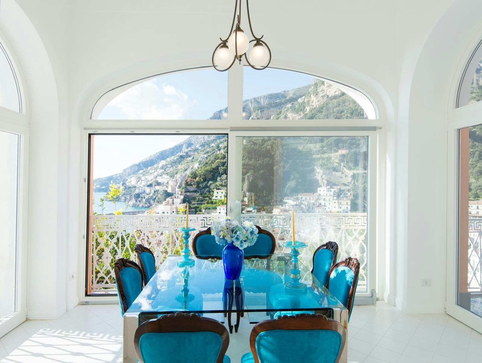 Riviera Vista Charm formal dining room with turquoise glass table, Amalfi, Amalfi Coast, Italy