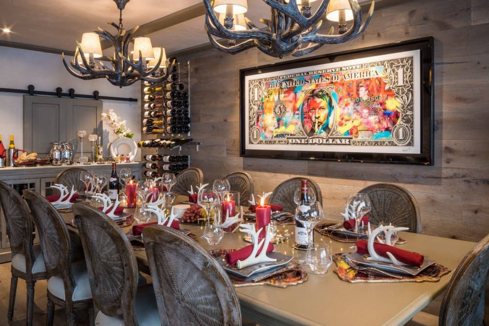 Courchevel 38 formal dining room with antler chandeliers and wine wall, Courchevel 1850, France