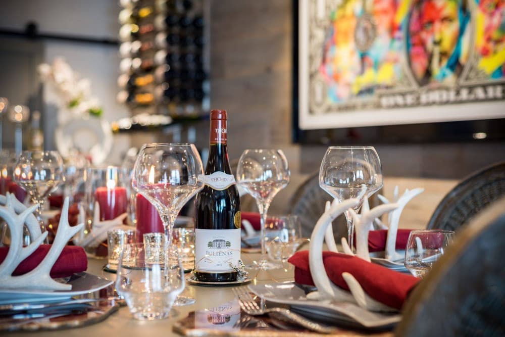 Courchevel 38 dining table detail with crystal glassware and Juliénas wine, Courchevel 1850, France