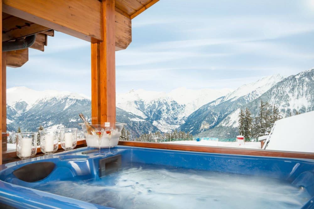 Courchevel 38 outdoor hot tub on timber terrace with Alpine valley views, Courchevel 1850, France