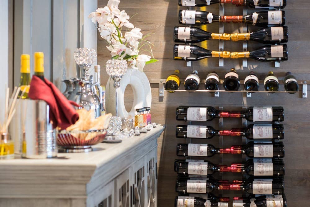 Courchevel 38 wine cellar display with champagne and orchid styling, Courchevel 1850, France