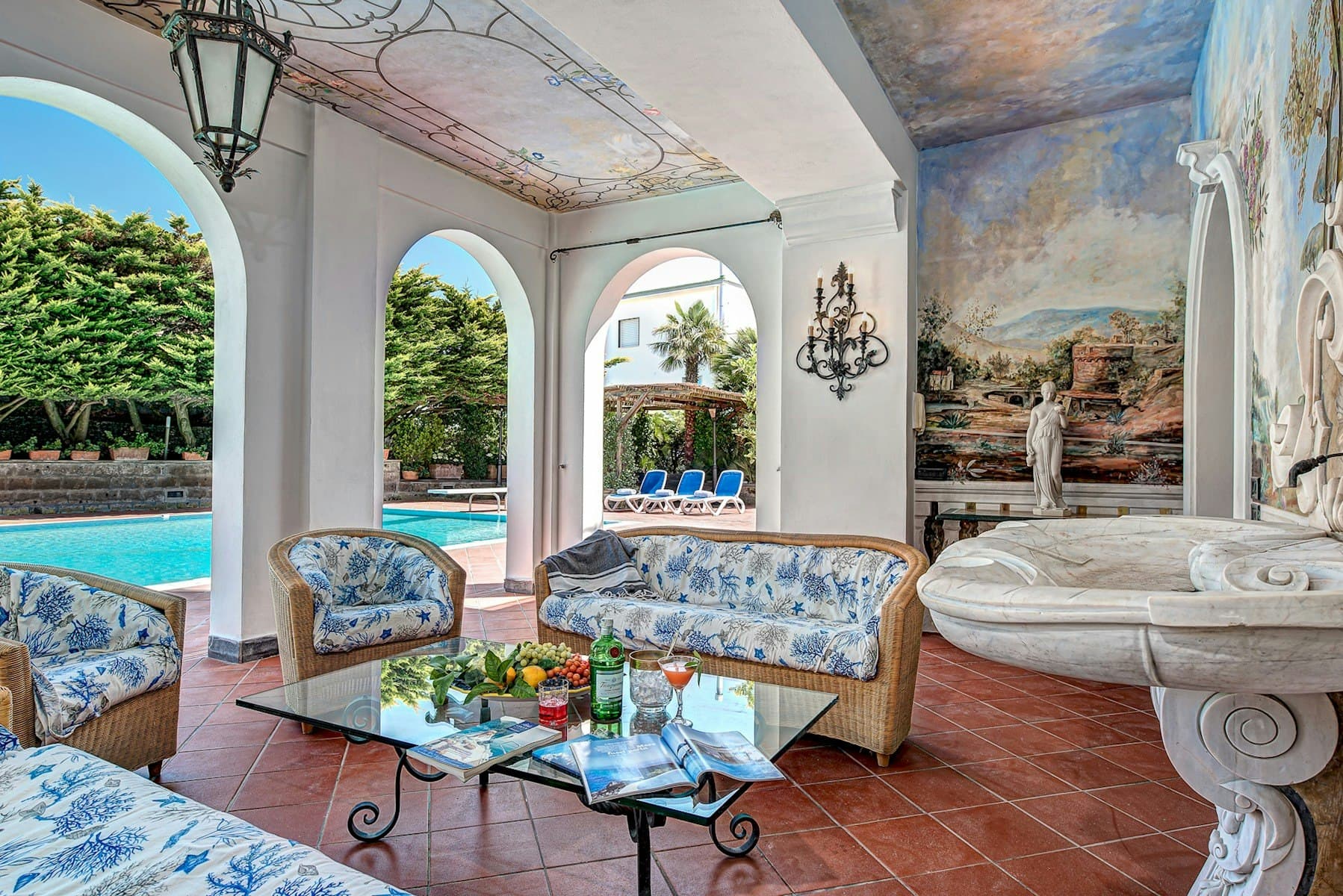 Painted Palace covered terrace with Renaissance frescoes and pool views, Sant'Agnello, Italy