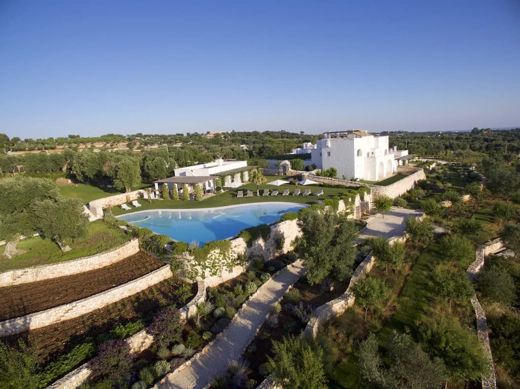 Masseria Monopoli aerial exterior with terraced limestone gardens and pool, Monopoli, Puglia, Italy