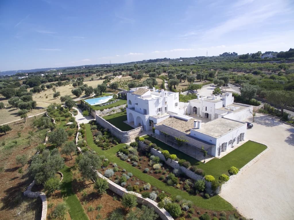 Masseria Monopoli aerial facade with formal gardens and stone boundary walls, Monopoli, Puglia, Italy