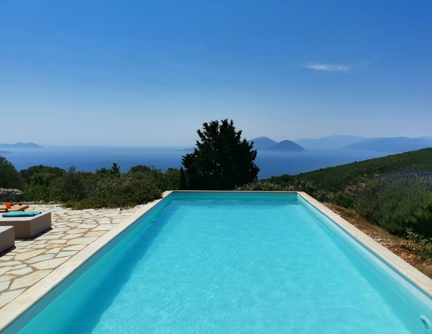 Sunset & Sea Lilies infinity pool overlooking the Ionian coastline, Lefkada, Greece