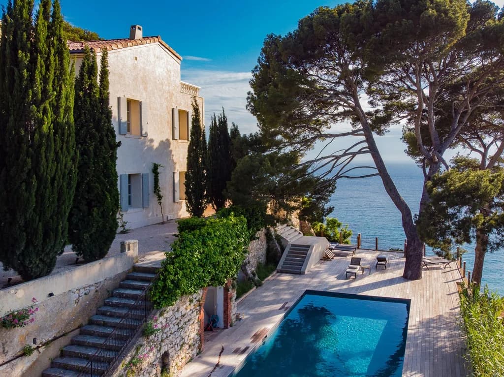 Villa Cassis cliffside pool on timber deck with cypress trees and sea views, Cassis, France