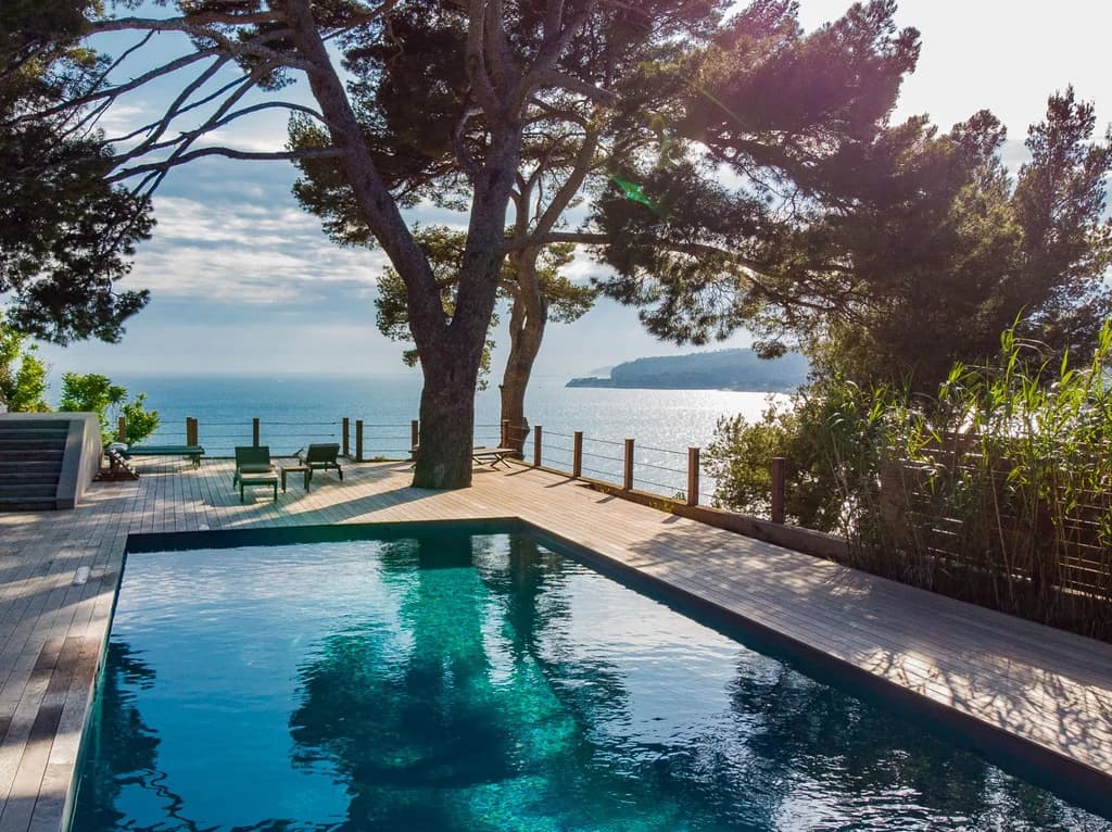 Villa Cassis golden hour ocean panorama with Mediterranean and pine-framed headland, Cassis, France