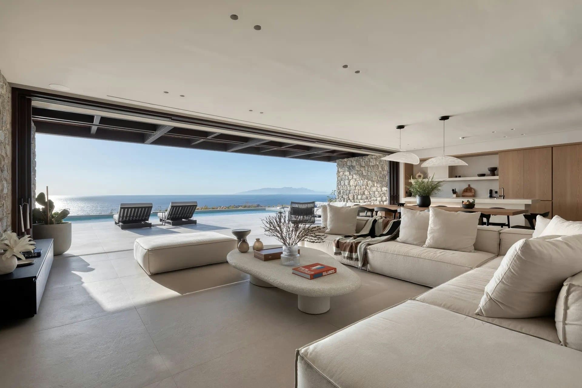 Indigo Light villa open-plan living room with pool views, Mykonos, Cyclades Islands, Greece