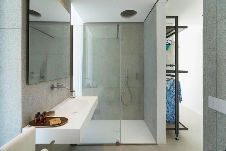 A Splash of Tangerine modern en-suite bathroom with rainfall shower, Marina di Noto, Sicily