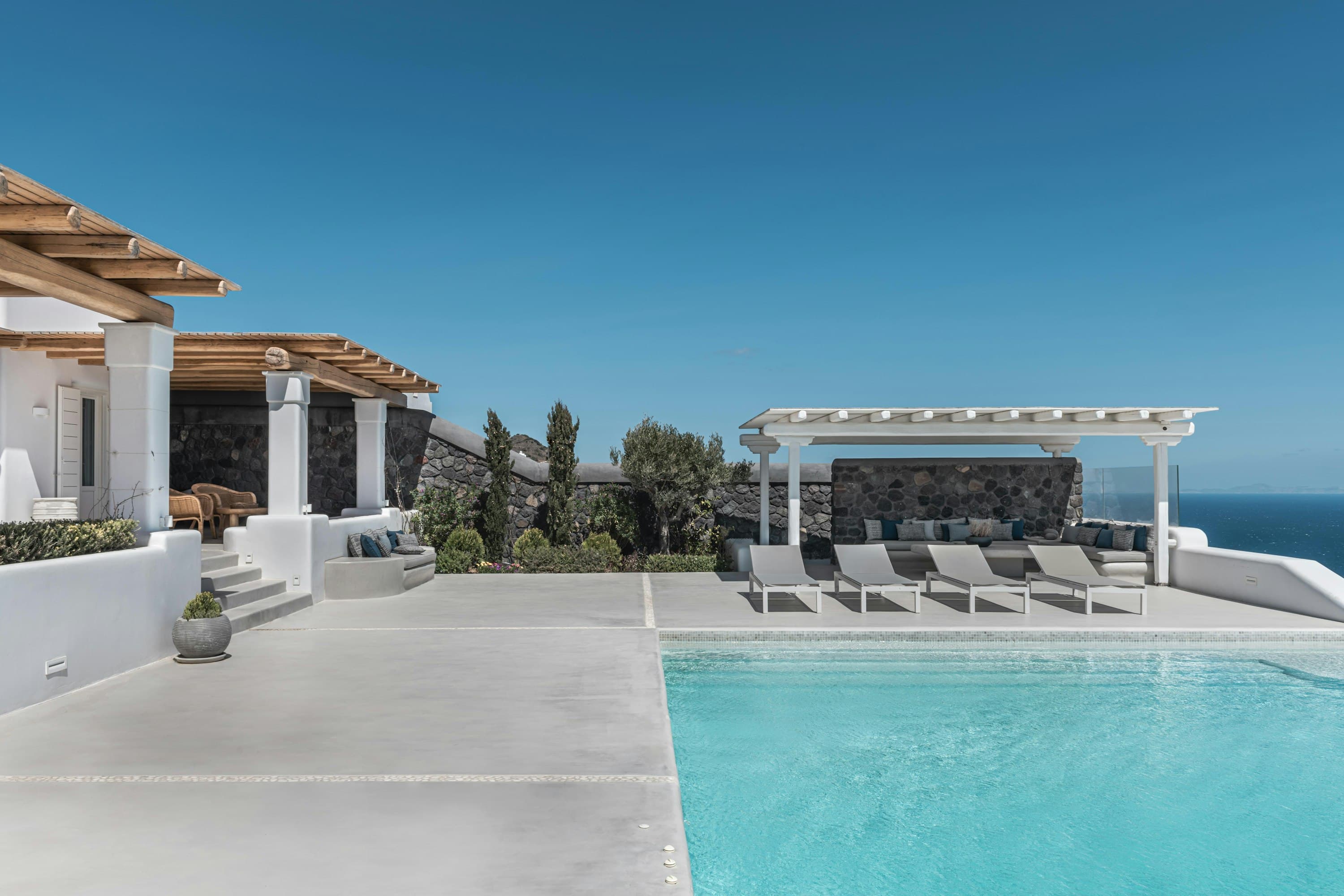 Whisper Of The Sea villa exterior with infinity pool and Aegean views, Imerovigli, Greece