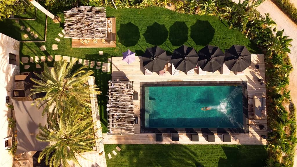 Spirit of Son Fuster aerial pool view with teak decking and lawns, Campanet, Majorca, Spain