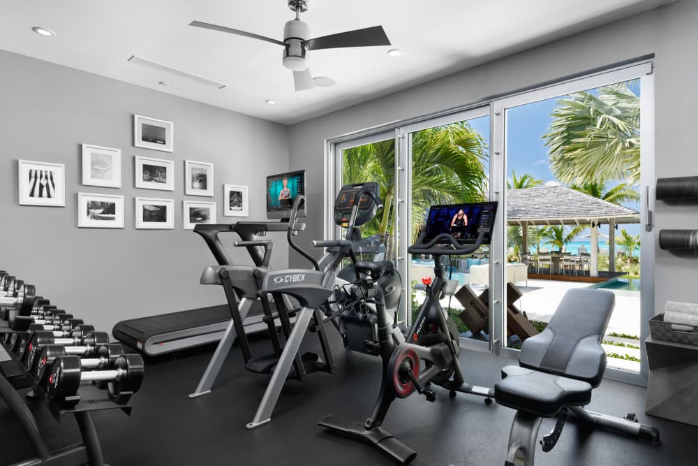 Sentosa villa media room with sectional sofa and Kartell chairs, Grace Bay, Turks and Caicos