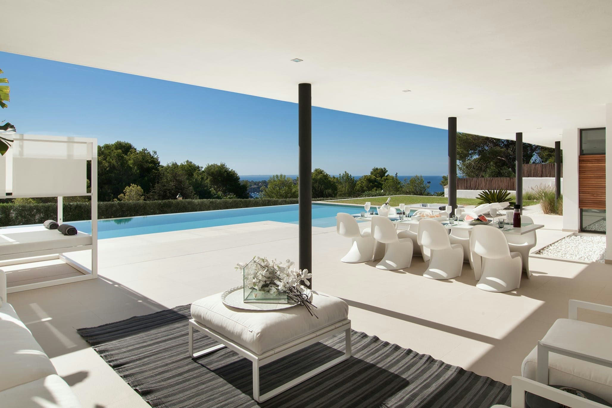 Waxing Crescent covered terrace with dining area, Sant Josep de sa Talaia, Balearic Islands, Spain