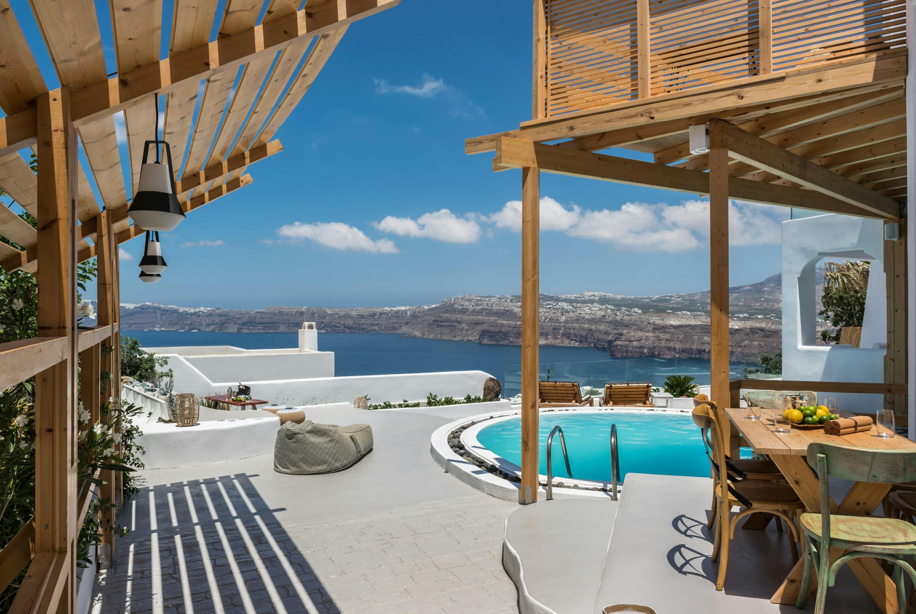 Hand of Hygieia caldera view from terrace with infinity pool, Santorini, Greece