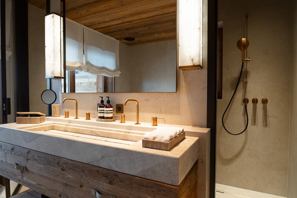 Courchevel 208 master ensuite with travertine vanity and brass taps, Courchevel 1850, France