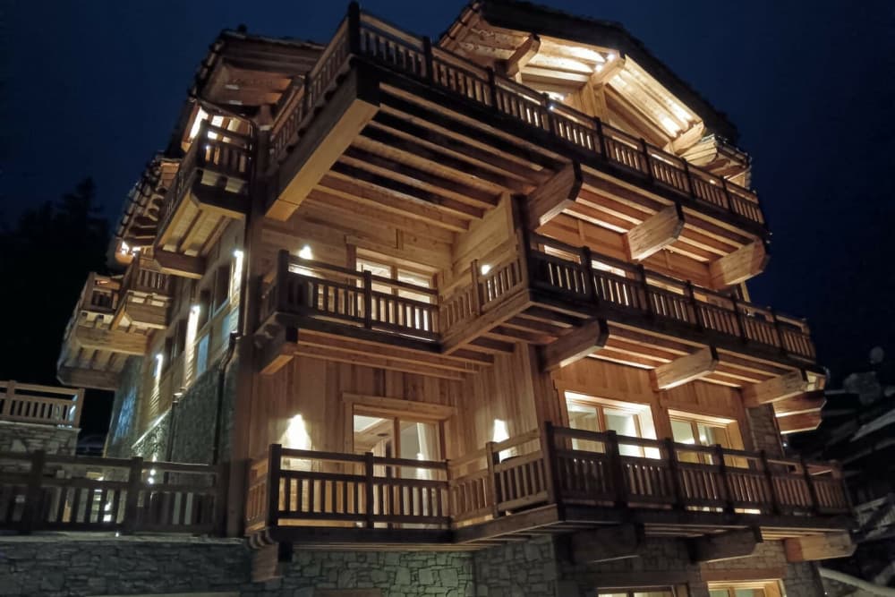 Courchevel 208 luxury chalet exterior at dusk, Courchevel 1850, French Alps, France