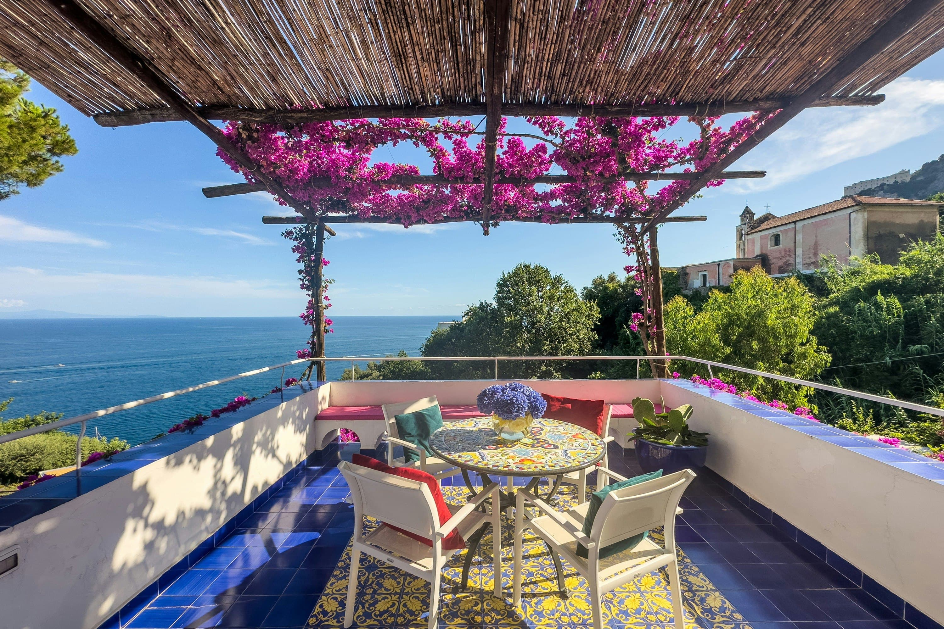 Graceful Sea rooftop terrace with bougainvillea pergola, Salerno, Amalfi Coast, Italy