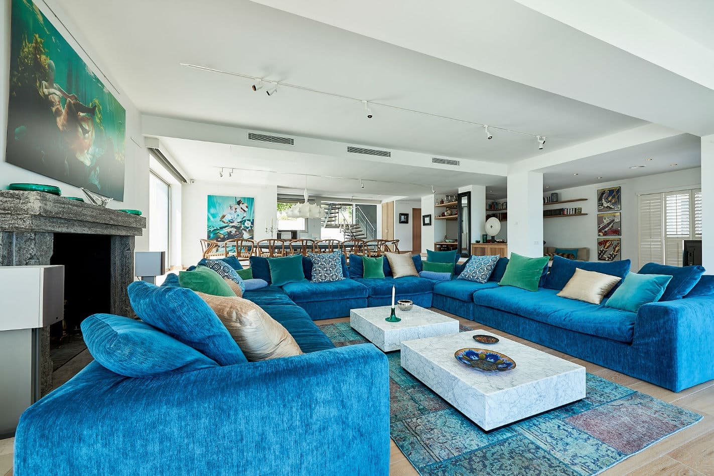 Somewhere On The Horizon living room with turquoise sofas and marble tables, Sant Josep de sa Talaia, Spain